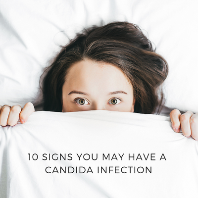 Photo of a woman under white sheet. Caption reads "10 Signs you may have a Candida infection"