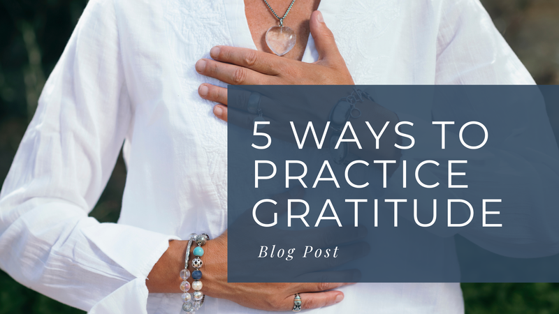 Photo of a woman with a hand on her heart and another hand on abdomen. Grey box caption reads 5 ways to practice gratitude. Blog post. 