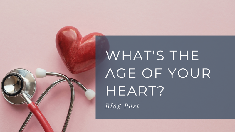 Photo of a red stethoscope and red heart shape on a pink background. Grey box caption reads "What's the age of your heart?" Blog post 