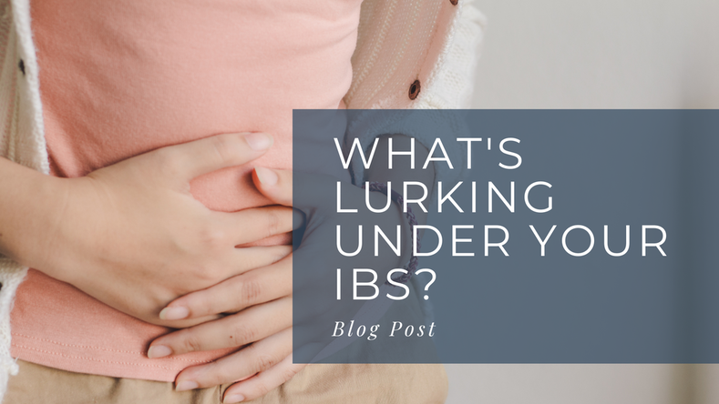 What's Lurking Under Your IBS -  Blog Post and photo of a woman in a peach t-shirt with hands braced over abdomen